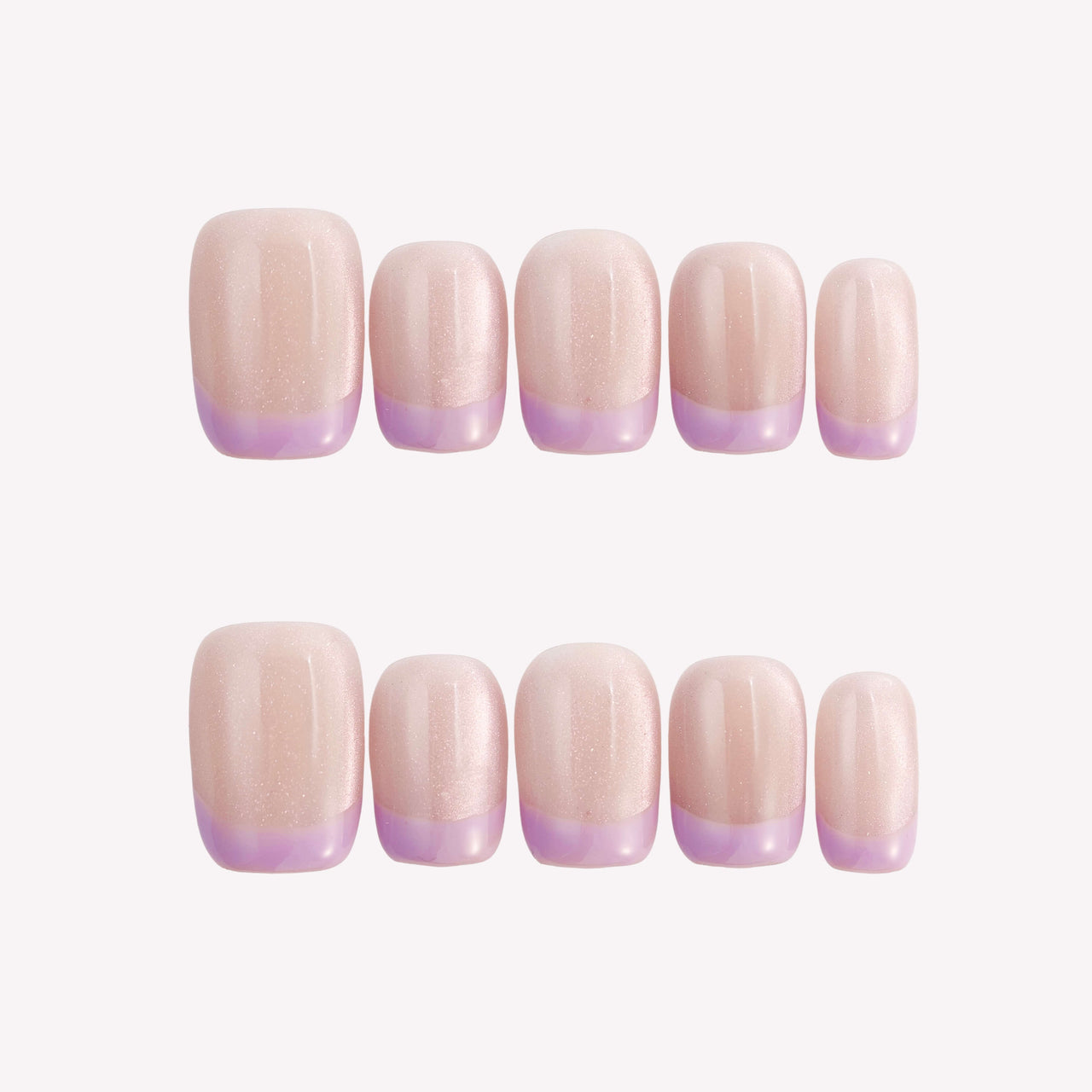 Set of beige nail extensions with a gradient purple tip on a white background