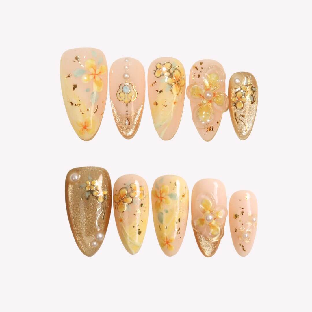 Set of decorative nail art with floral designs on a light background
