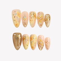 Thumbnail for Set of decorative nail art with floral designs on a light background